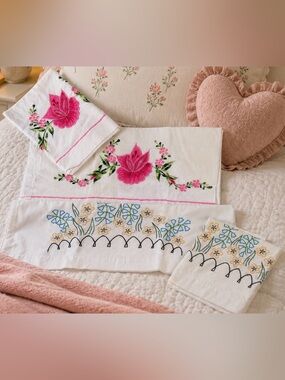 2 sets of Embroidered Floral Pillowcases. Needs proper cleaning